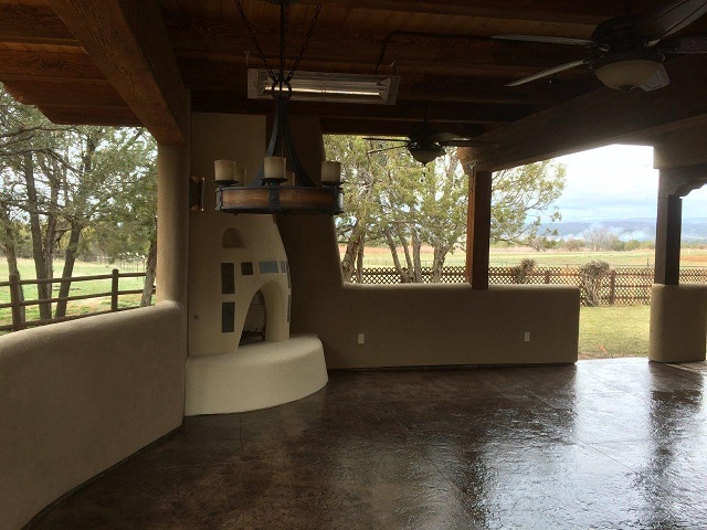 Kiva Style Fireplace A Built In Hot Tub And An Outdoor Kitchen Area